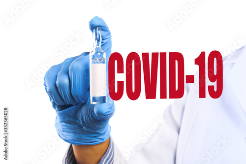 doctor holding a vaccine against the virus COVID-19 . Anti COVID-19 vaccine concept - Image