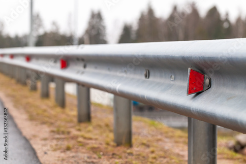 Konstfotografi Retro-reflecting optical units are on a metal guardrail