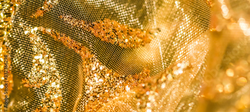 Golden abstract blur defocused background. Concept for New Years Eve, Christmas and happy holidays © OLAYOLA