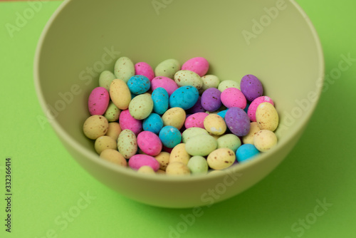 Assortment of colorful speckled eggs in a bowl