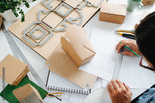 The top view of workplace packaging designer. photo