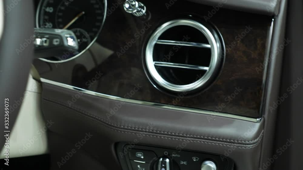 Detail shot of interior wood trim of luxurious car Detail shot of interior wood trim of luxurious car