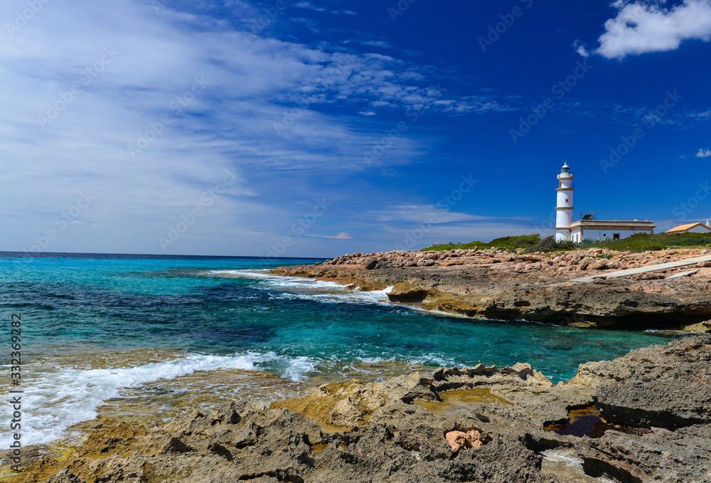 Lighthouse at Cap de Ses Salines on Majorca island, Spain Mediterranean Sea