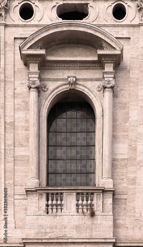 Old window on stone facade