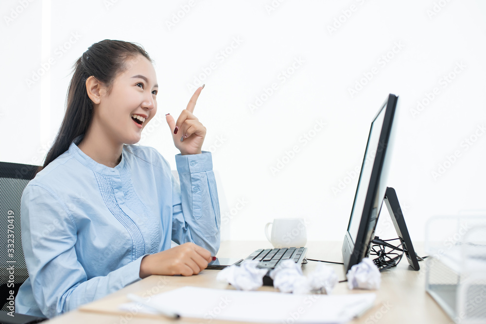 Asian success businesswoman happy action get idea from using laptop computer connect internet working from home in glass room big window with copy space Asian success businesswoman happy action get idea from using laptop computer connect internet working from home in glass room big window with copy space