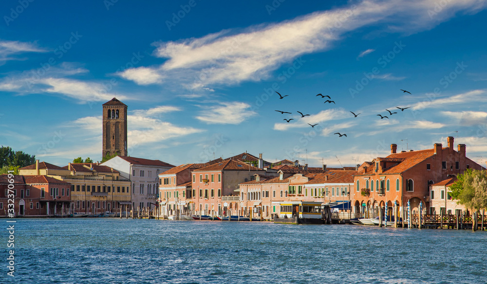 Buildings and a water bus station along the Grand Canal in Venice