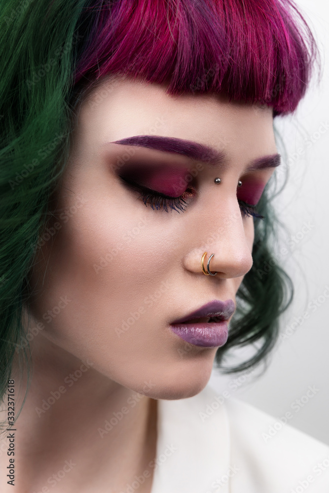Fototapeta premium Beautiful woman with purple green professional colored hair
