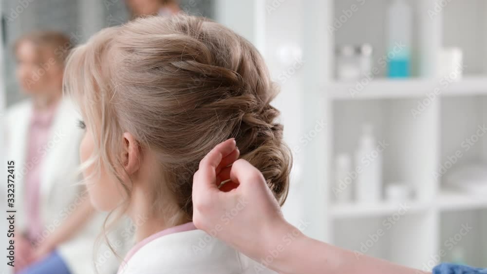 Female stylist hands applying hairspray fixing plaiting hairstyle. 4k Dragon RED camera Female stylist hands applying hairspray fixing plaiting hairstyle. 4k Dragon RED camera