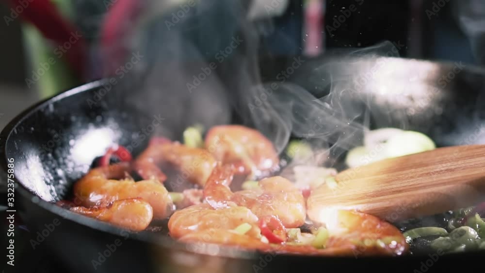 Prawns are fried in a pan, slow motion. Prawns are fried in a pan, slow motion.