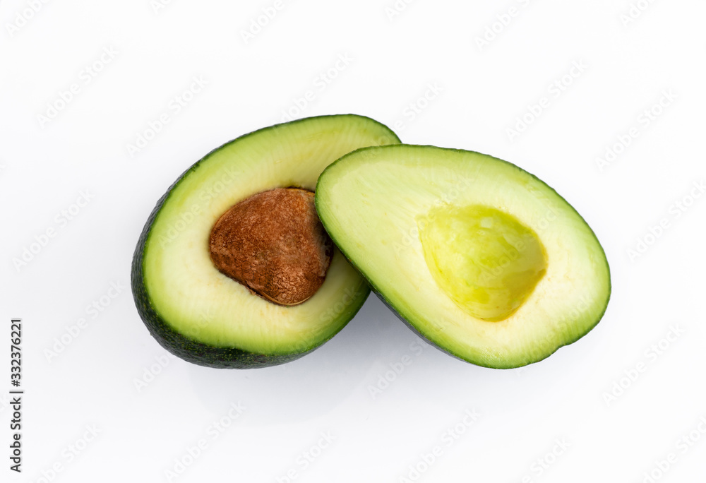  avocado cut isolated on a white background. avocado bone inside
