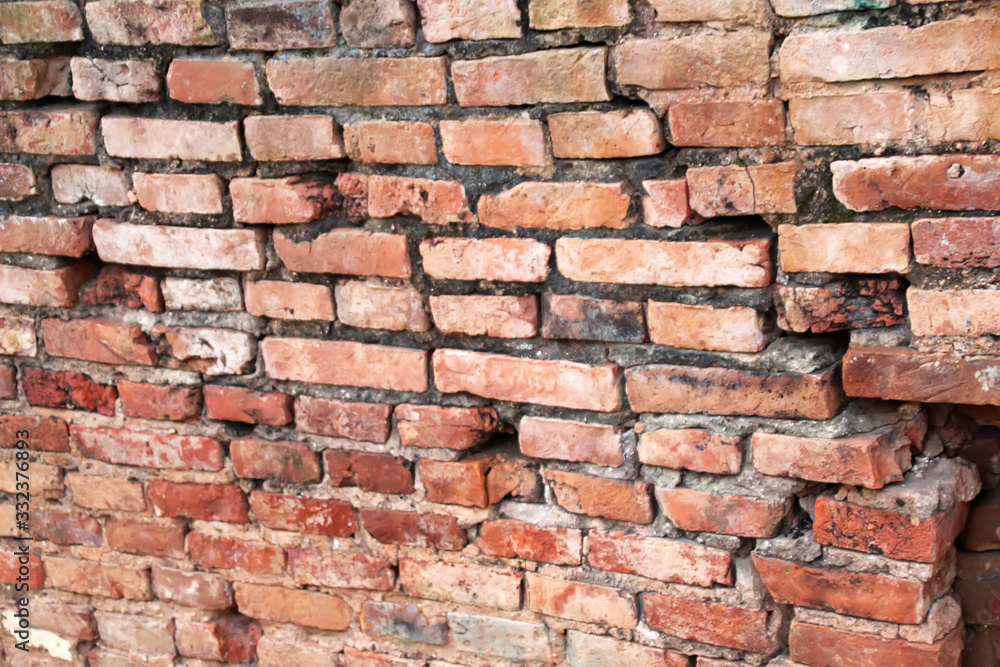 19 Old orange brick wall with breaks in a Buddhist temple 19 Old orange brick wall with breaks in a Buddhist temple