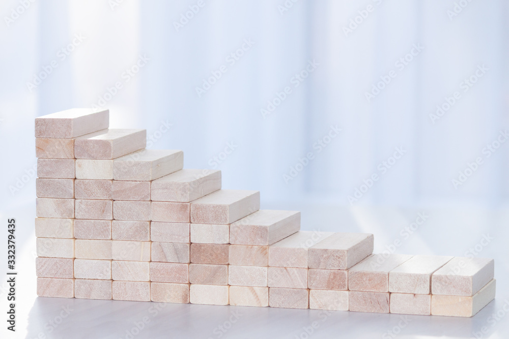 Declining graph from wooden blocks. Financial concept. Copy space. Declining graph from wooden blocks. Financial concept. Copy space.