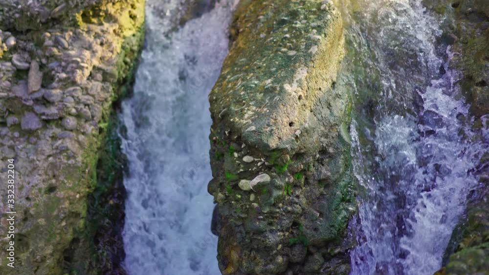 Mountainous strong river flow forming a waterfall Mountainous strong river flow forming a waterfall