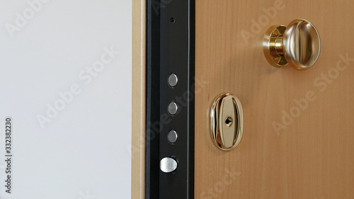 Photos A close up of a security door locking system against burglary or housebreaking