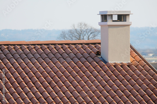 New roof tiles and a chimney of a house