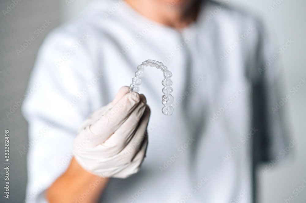 People in a dental lab working in the fabrication process of dental transparent aligners