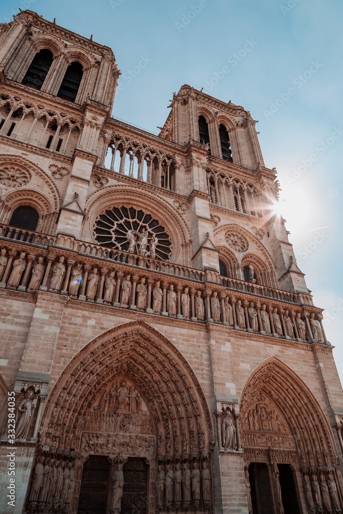 Front view of the facade of Notre Dame Cathedral on a sunny day