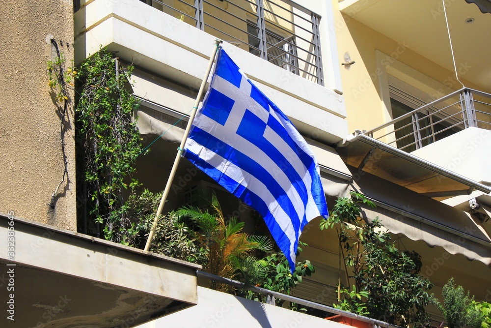 Athens, Greece, March 22 2020 - Greek flag on a balcony