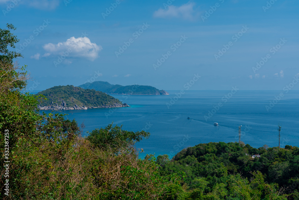 View from the top of the mountain on beautiful blue lagoon and islands covered with green jungles