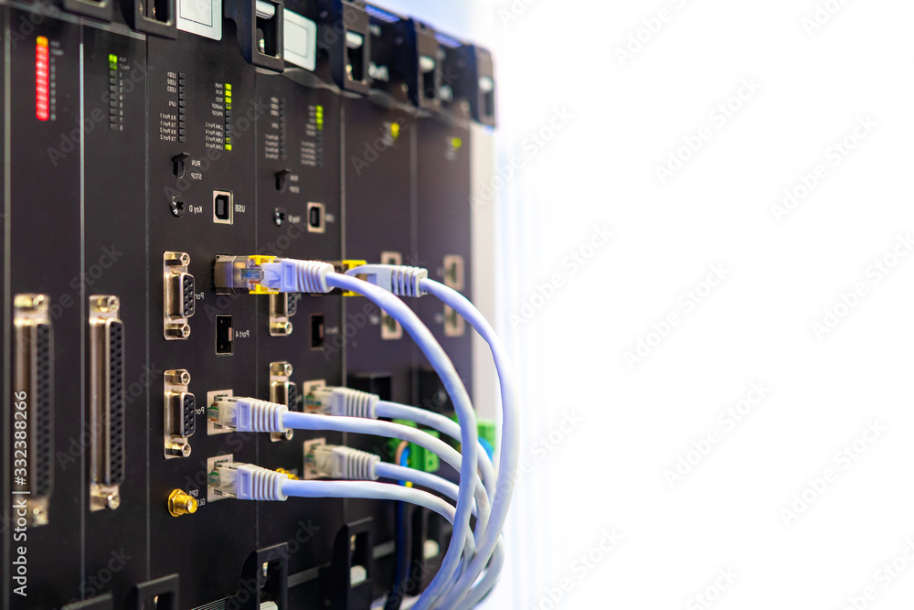 Network hardware. Optical fiber. White cables are connected to network equipment. Server close up. A fragment of server hardware. Place for text near the server. Providing Internet in the company Network hardware. Optical fiber. White cables are connected to network equipment. Server close up. A fragment of server hardware. Place for text near the server. Providing Internet in the company