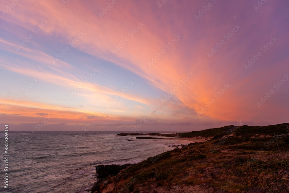 Beautiful glowing sunset over ocean beach in Beachport, South Austrlaia Beautiful glowing sunset over ocean beach in Beachport, South Austrlaia