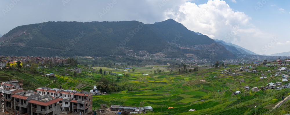 Terraced Green Hillsides surrounded by Small Cities
