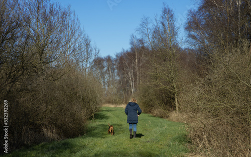 Walking the dog. National Park Weerribben de Wieden. Wetering. Overijssel Netherlands.