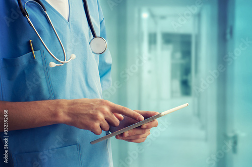 Healthcare And Medicine. Doctor using a digital tablet