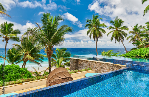 Beach with resort swimming pool at Seychelles