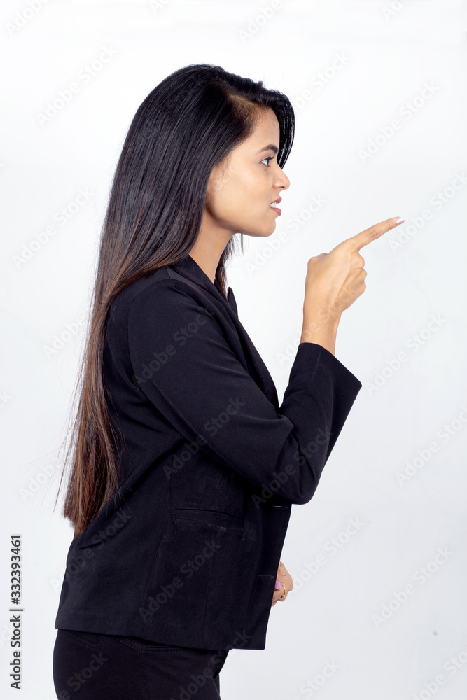 Profile shot of Indian businesswoman giving warning sign Profile shot of Indian businesswoman giving warning sign