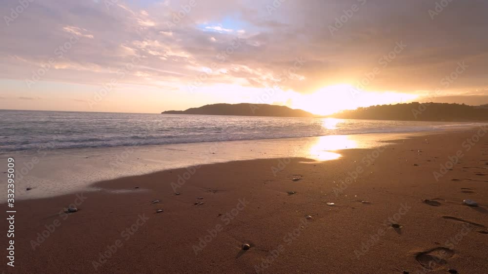 Calm and serene surf swash on deserted beach in sunset. Calm and serene surf swash on deserted beach in sunset.