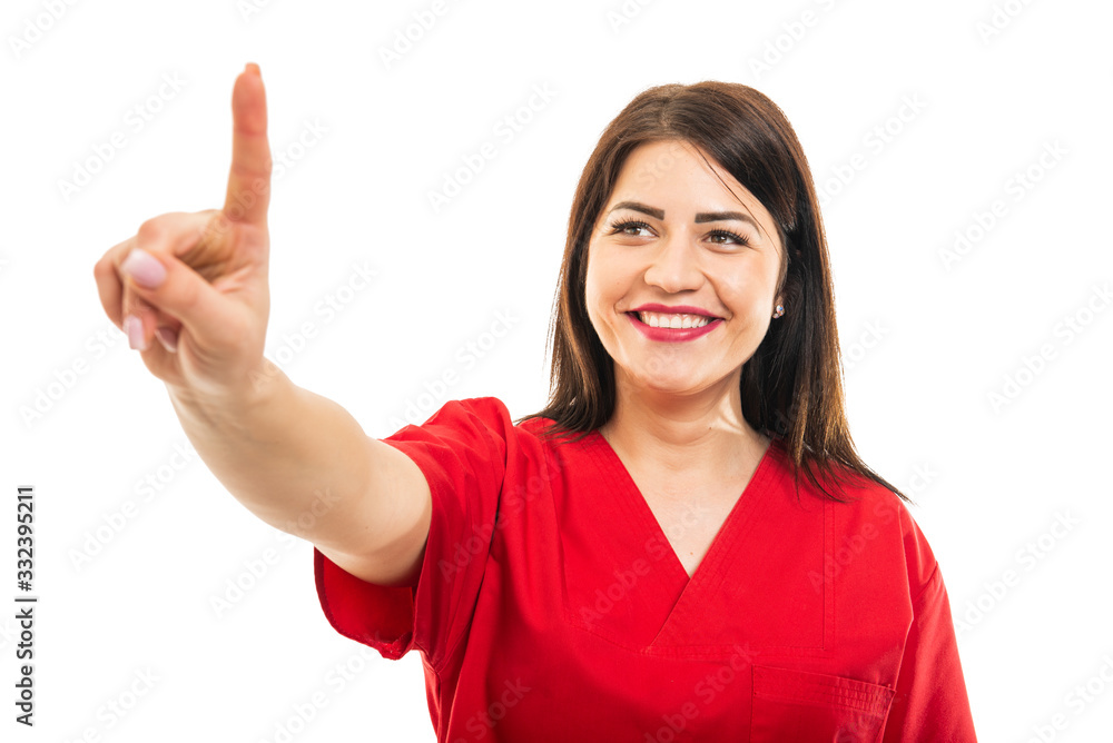 Portrait of beautiful young doctor wearing scrubs using touchscreen Portrait of beautiful young doctor wearing scrubs using touchscreen