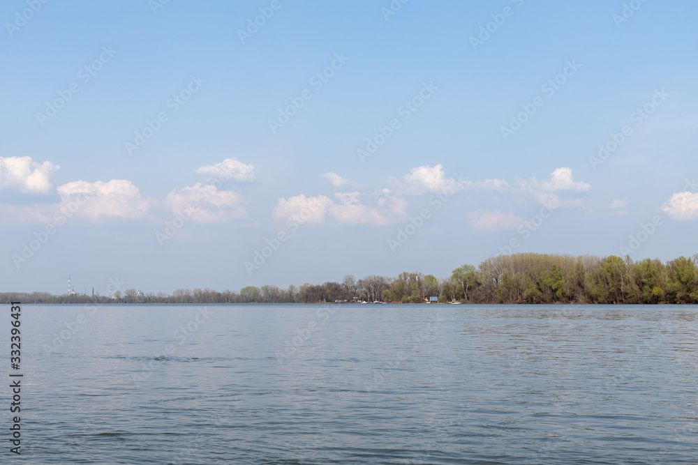 Danube River With Forest In The Background On The Sunny Day Danube River With Forest In The Background On The Sunny Day
