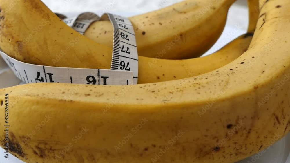 Banana and tape measure on 360 rotating stand, banana and diet, banana in weight loss, Banana and tape measure on 360 rotating stand, banana and diet, banana in weight loss,