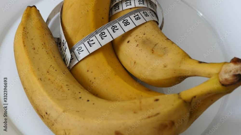 Banana and tape measure on 360 rotating stand, banana and diet, banana in weight loss, Banana and tape measure on 360 rotating stand, banana and diet, banana in weight loss,