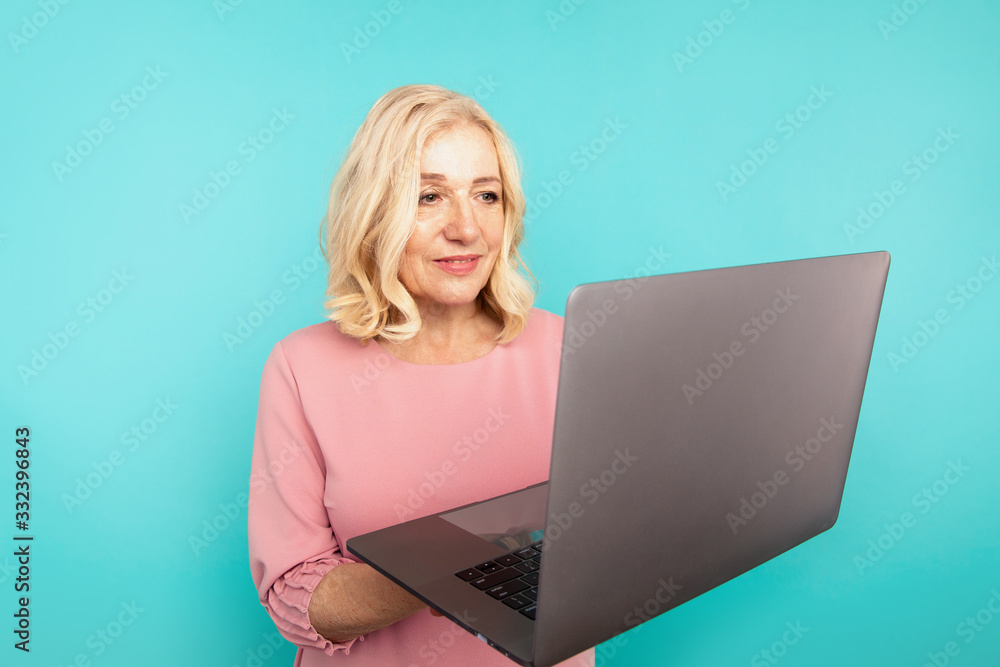 Midage woman with laptop isolated check her mail and typing Midage woman with laptop isolated check her mail and typing