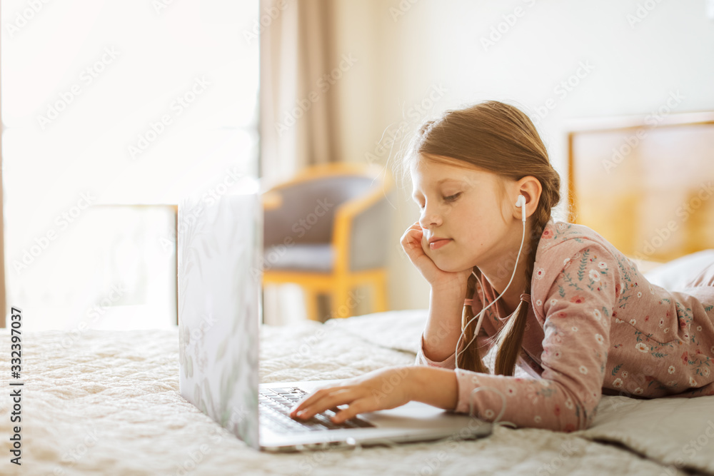 home schooling,child with laptop does homework home schooling,child with laptop does homework