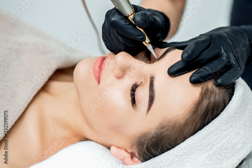 Permanent makeup on eyebrows.