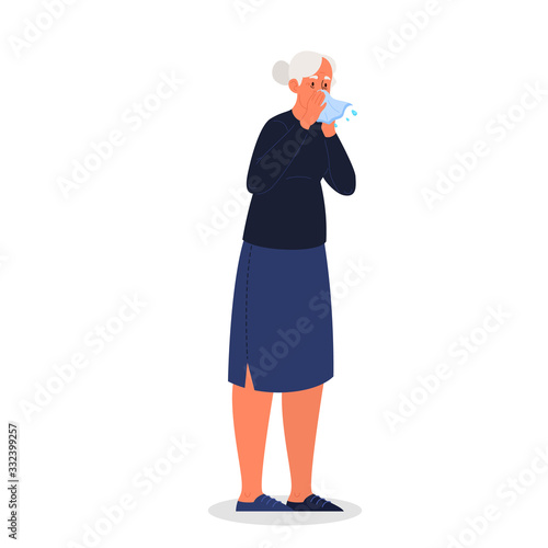 Sick old woman with runny nose a symptom of flu, cold or allergy