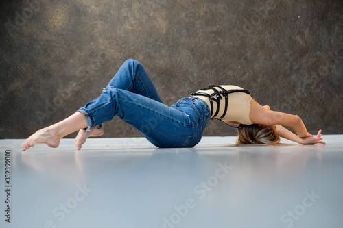 beautiful girl stretching coach in the studio