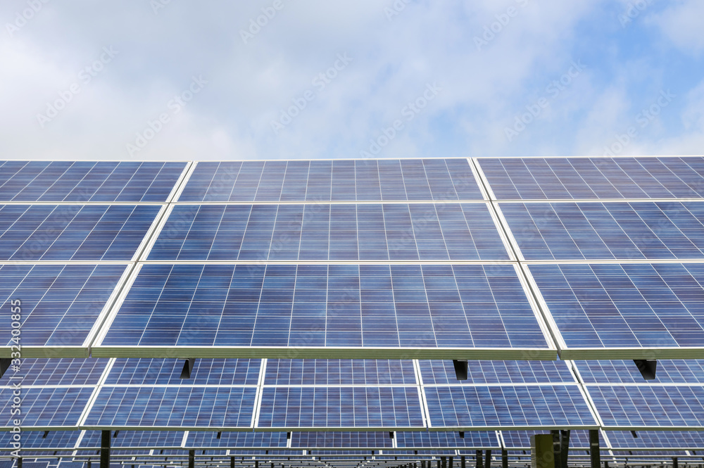 Close up rows array of polycrystalline silicon solar cells or photovoltaic cells in solar power plant turn up skyward absorb the sunlight from the sun Close up rows array of polycrystalline silicon solar cells or photovoltaic cells in solar power plant turn up skyward absorb the sunlight from the sun