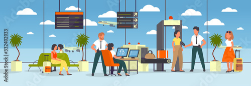 Airport terminal. Woman going through the metal scanner.