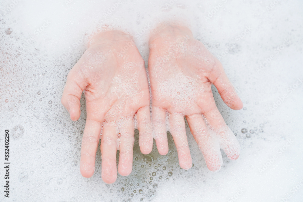Fototapeta premium Child washing hand in bathroom.