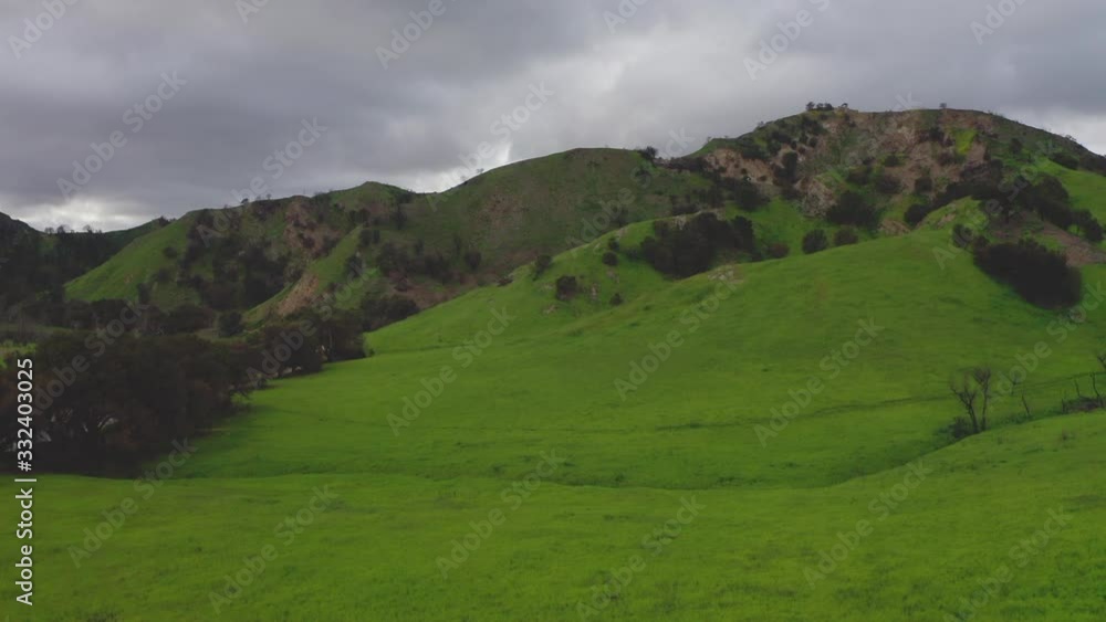 Reverse Aerial Of Beautiful Green Hills And Mountains In Malibu Creek State National Park Reverse Aerial Of Beautiful Green Hills And Mountains In Malibu Creek State National Park