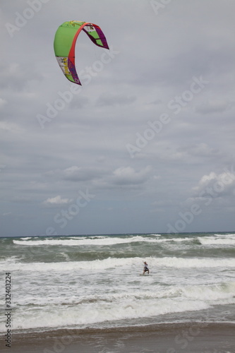 kite surfing on the grey sea