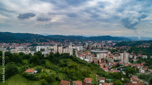 Aerial view of downtown Tuzla at sunset, Bosnia. City photographed by drone, traffic and objects , landscape.city photographed from air by drone.Old balkan buildings and communism type of architecture © adis97