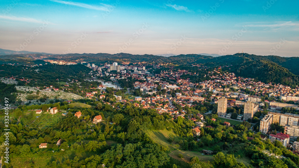 Aerial view of downtown Tuzla at sunset, Bosnia. City photographed by drone, traffic and objects , landscape.city photographed from air by drone.Old balkan buildings and communism type of architecture