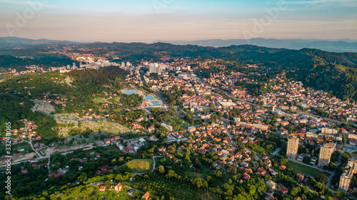 Aerial view of downtown Tuzla at sunset, Bosnia. City photographed by drone, traffic and objects , landscape.city photographed from air by drone.Old balkan buildings and communism type of architecture