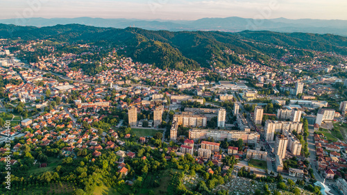 Aerial view of downtown Tuzla at sunset, Bosnia. City photographed by drone, traffic and objects , landscape.city photographed from air by drone.Old balkan buildings and communism type of architecture © adis97