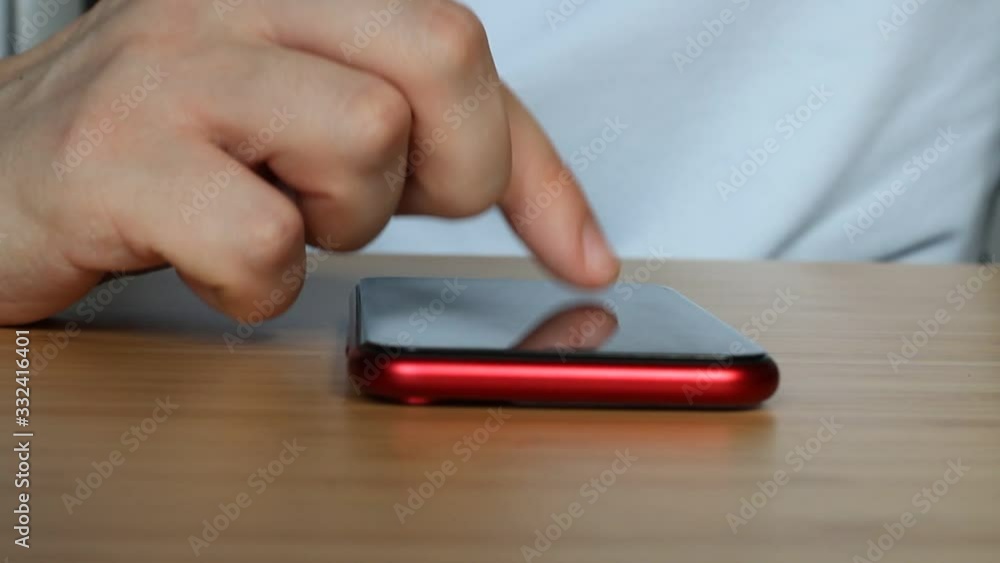 Man using smartphone scrolling through social media, doing swiping, scrolling gestures. Male texting SMS with mobile telephone. Man using smartphone scrolling through social media, doing swiping, scrolling gestures. Male texting SMS with mobile telephone.
